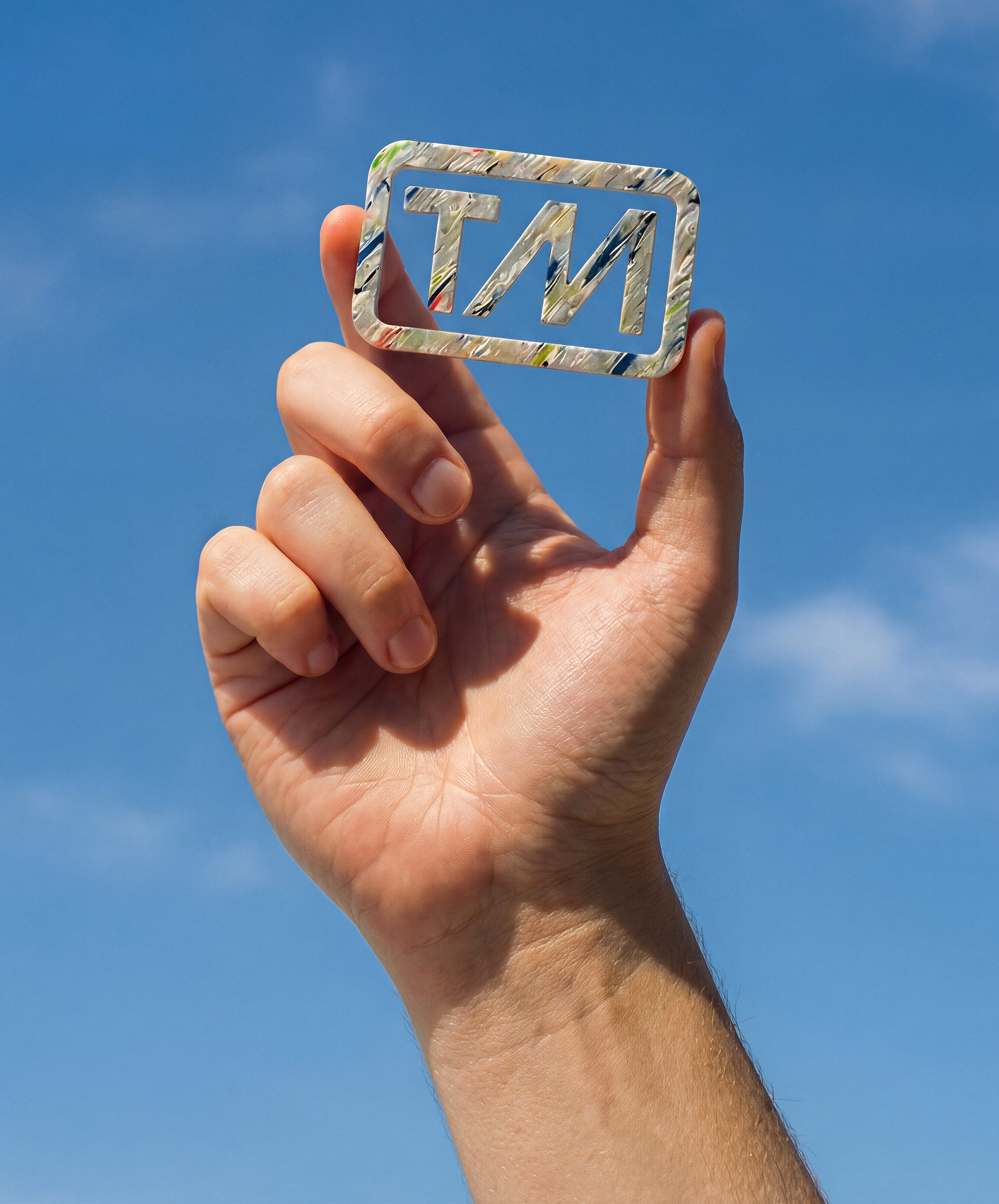 Stylized blue and pink image of a whiskey glass with the wordmark of Vèloce in pink all-caps letters above.